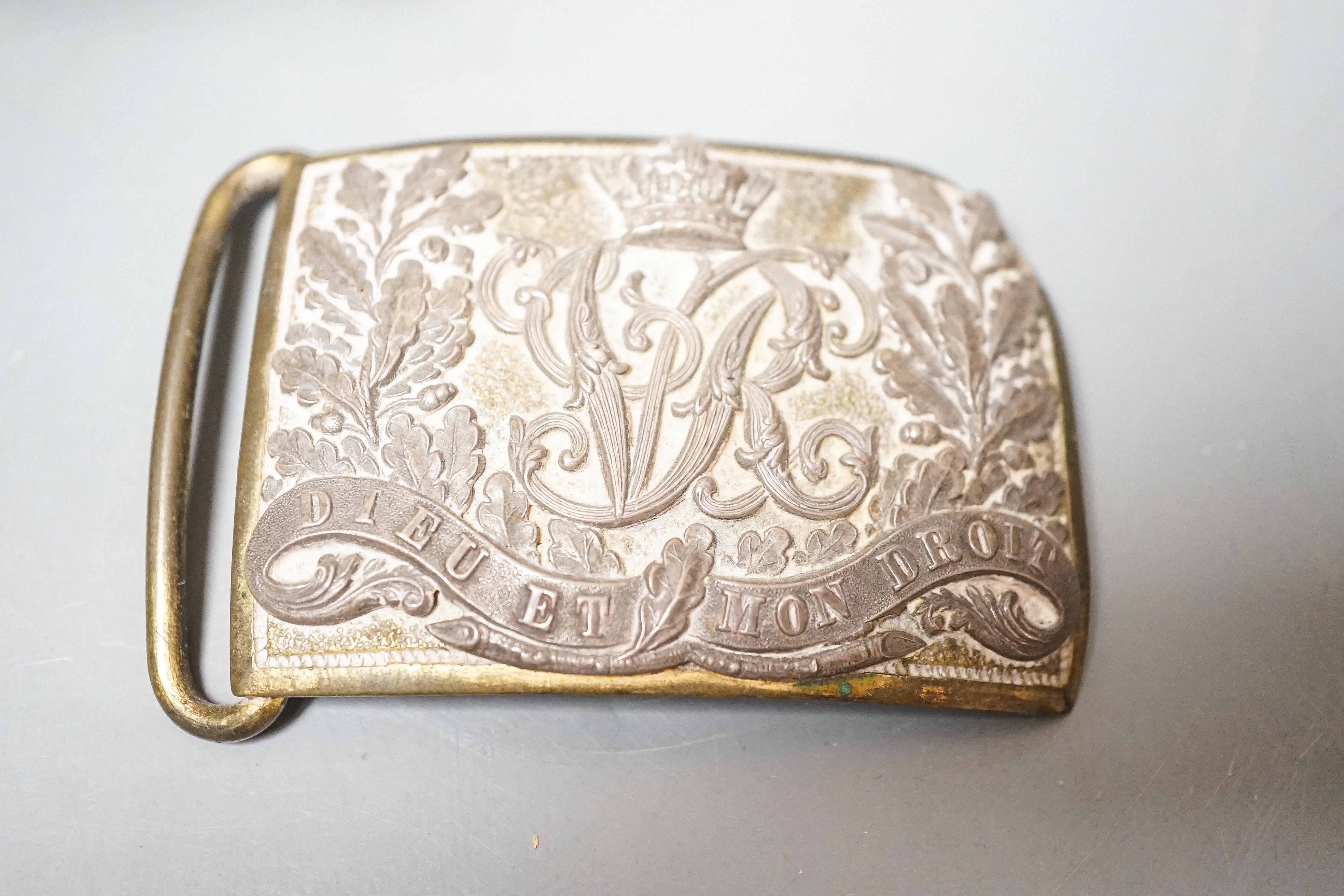 A Victorian regimental belt buckle, Prince of Wales plume, coconut cup, 13cm